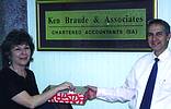 Ken Braude and Secretary Lottie Cohen perform the SAIMC Interkama lucky draw